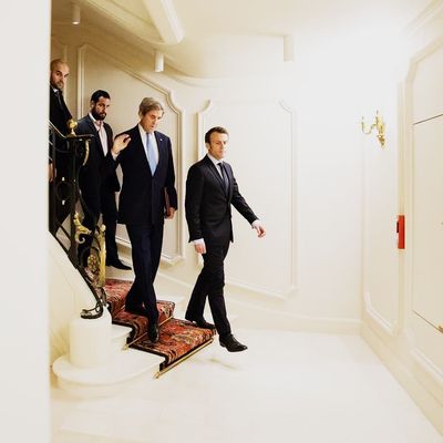 Alexandre Benalla with President Emmanuel Macron and U.S. Secretary of State John Kerry at the Elysee Palace