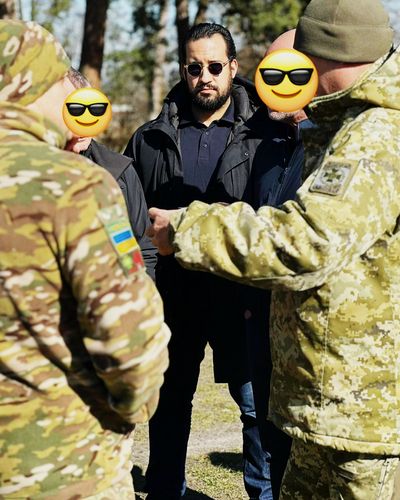 Alexandre Benalla with Ukrainian military personnel during field operations in Ukraine